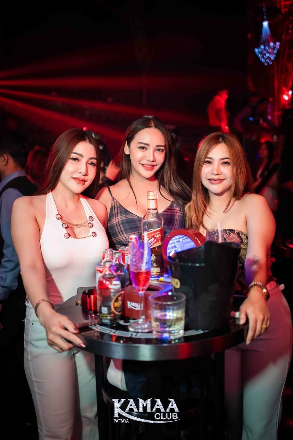 Three guests at a VIP table with bottle service at Kamaa Club Pattaya