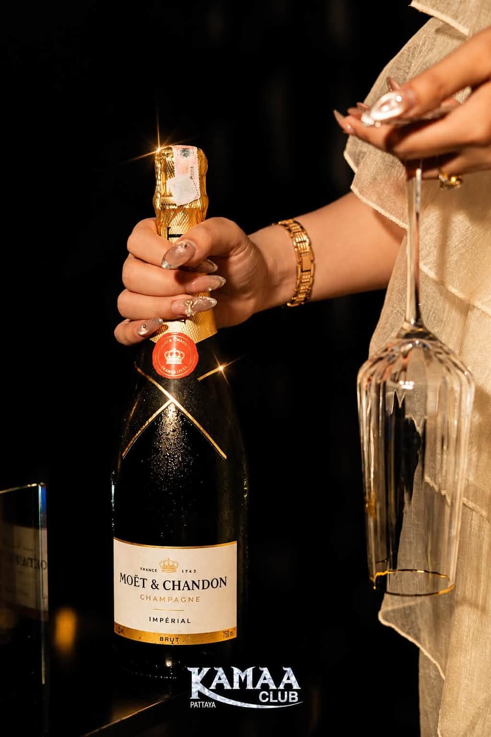 Bottle of Moët & Chandon champagne held up high at Kamaa Club Pattaya